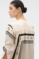 Profile view of model wearing the Oroton Spot Scarf Print Blouse in NOUGAT and 100% silk twill fabric for Women .