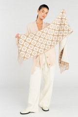 Profile view of model wearing the Oroton Harvey Signature Two Tone Scarf in Cream/Tan and 50% acrylic, 50% wool for Women .