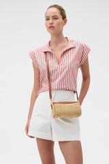 Profile view of model wearing the Oroton Harvey Crochet Baguette Crossbody in NATURAL/COGNAC and Woven straw material for Women .