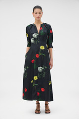 Profile view of model wearing the Oroton Wild Flower Print Dress in BLACK and 100% silk twill fabric for Women .