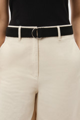 Profile view of model wearing the Oroton Quinn Webbing Belt in WASHED BLACK and 100% cotton material for Women .