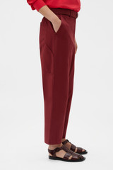 Profile view of model wearing the Oroton Arlo Carpenter Chino in Rouge and 100% cotton fabric for Women . IP:4