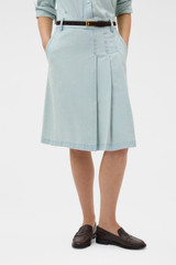 Profile view of model wearing the Oroton Chambray Skirt in Chambray and 100% cotton fabric for Women .