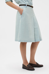 Profile view of model wearing the Oroton Chambray Skirt in Chambray and 100% cotton fabric for Women .