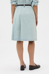 Profile view of model wearing the Oroton Chambray Skirt in Chambray and 100% cotton fabric for Women .