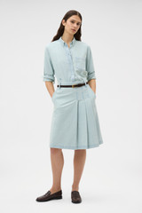 Profile view of model wearing the Oroton Chambray Skirt in Chambray and 100% cotton fabric for Women .