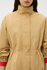 Profile view of model wearing the Oroton Arlo Washed Parka in Cashew and 100% cotton fabric for Women . IP:4