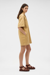Profile view of model wearing the Oroton Drill Popover Dress in Cashew and 100% cotton fabric for Women . IP:3