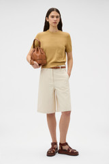 Profile view of model wearing the Oroton Cotton Short Sleeve Knit in Cashew and 100% cotton fabric for Women . IP:6