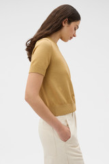 Profile view of model wearing the Oroton Cotton Short Sleeve Knit in Cashew and 100% cotton fabric for Women .