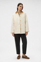 Profile view of model wearing the Oroton Cotton Chore Jacket in Calico and 100% cotton fabric for Women .