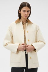 Profile view of model wearing the Oroton Cotton Chore Jacket in Calico and 100% cotton fabric for Women .