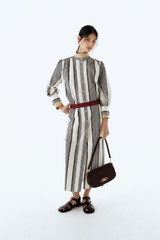 Profile view of model wearing the Oroton Weekend Stripe Dress in Calico and 100% cotton fabric for Women .