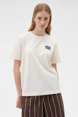 Profile view of model wearing the Oroton Maggie Graphic Tee in Calico and 100% cotton single jersey fabric for Women .