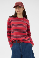 Profile view of model wearing the Oroton Long Sleeve Stripe Tee in Market Red and 100% cotton fabric for Women . IP:2