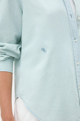Profile view of model wearing the Oroton Chambray Shirt in Chambray and 100% cotton fabric for Women . IP:4