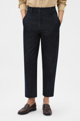 Profile view of model wearing the Oroton Denim Pant in Dark Blue and 90% cotton and 10% polyester blend fabric for Women .