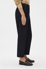 Profile view of model wearing the Oroton Denim Pant in Dark Blue and 90% cotton and 10% polyester blend fabric for Women .