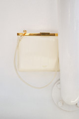 Detail product shot of the Oroton Icon Clutch in Clotted Cream and Premium embossed leather for Women .