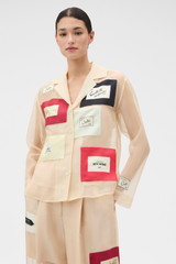 Profile view of model wearing the Oroton Patched Vintage Label Shirt in Nougat and 100% sheer silk organdy fabric for Women .