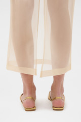 Profile view of model wearing the Oroton Organdy Pencil Skirt in Nougat and 100% silk fabric for Women .