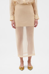 Profile view of model wearing the Oroton Organdy Pencil Skirt in Nougat and 100% silk fabric for Women .