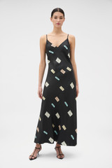 Profile view of model wearing the Oroton Vintage Label Slip Dress in Black and 100% silk twill fabric for Women .