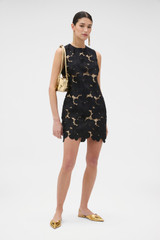Profile view of model wearing the Oroton Poppy Lace Mini Dress in Black and 100% polyester fabric for Women . IP:6