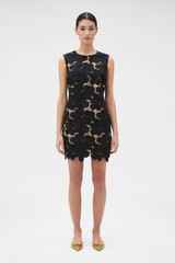 Profile view of model wearing the Oroton Poppy Lace Mini Dress in Black and 100% polyester fabric for Women .