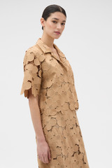 Profile view of model wearing the Oroton Poppy Lace Crop Shirt in Camel and 100% polyester fabric for Women .
