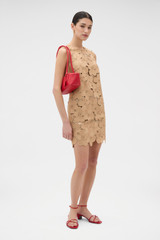 Profile view of model wearing the Oroton Poppy Lace Mini Dress in Camel and 100% polyester fabric for Women .