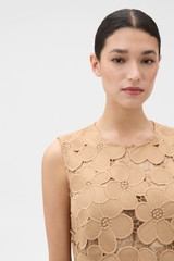 Profile view of model wearing the Oroton Poppy Lace Mini Dress in Camel and 100% polyester fabric for Women .