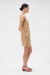 Profile view of model wearing the Oroton Poppy Lace Mini Dress in Camel and 100% polyester fabric for Women .