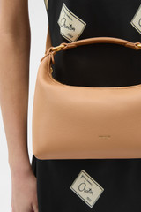 Profile view of model wearing the Oroton Winnie Small Bag in Brulee and Premium smooth leather for Women .