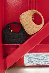 Detail product shot of the Oroton Clara Straw Mini Bag in Natural and Woven straw material for Women .