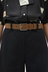 Profile view of model wearing the Oroton Florence 35MM Belt in Teak and Premium crackle leather for Women .
