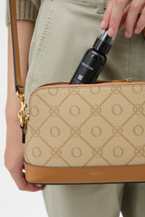 Profile view of model wearing the Oroton Harvey Signature Double Top Zip Crossbody in Stone/Tan and Nylon canvas base cloth material with PVC coating (70% PVC, 30% polyester) for Women .