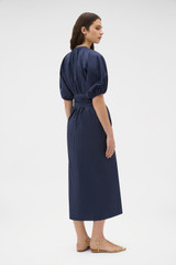 Profile view of model wearing the Oroton Grace Popover Dress in North Sea and 100% cotton poplin fabric for Women .