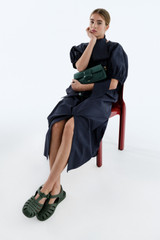 Profile view of model wearing the Oroton Grace Popover Dress in North Sea and 100% cotton poplin fabric for Women .