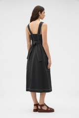 Profile view of model wearing the Oroton Pocket Detail Dress in Washed Black and 100% cotton canvas fabric for Women .