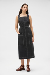 Profile view of model wearing the Oroton Pocket Detail Dress in Washed Black and 100% cotton canvas fabric for Women .