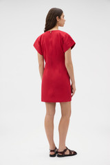 Profile view of model wearing the Oroton Stitch Detail Mini Dress in Cerise and 100% cotton canvas fabric for Women .
