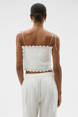 Profile view of model wearing the Oroton Handkerchief Top in Antique White and 100% mid-weight linen fabric for Women .