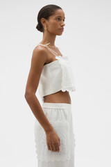 Profile view of model wearing the Oroton Handkerchief Top in Antique White and 100% mid-weight linen fabric for Women .