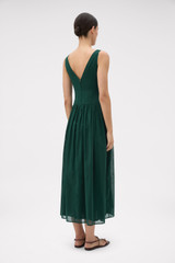 Profile view of model wearing the Oroton Yoke Detail Sundress in Helm Green and 100% lightweight semi-sheer cotton voile fabric for Women .