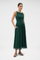 Profile view of model wearing the Oroton Yoke Detail Sundress in Helm Green and 100% lightweight semi-sheer cotton voile fabric for Women .