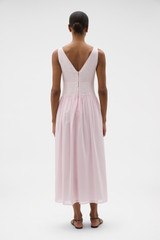 Profile view of model wearing the Oroton Yoke Detail Sundress in Rose and 100% lightweight semi-sheer cotton voile fabric for Women .