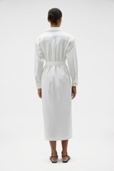 Profile view of model wearing the Oroton Button Detail Shirt Dress in White and 100% cotton poplin fabric for Women .