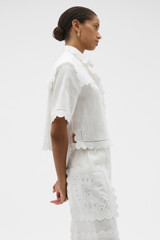 Profile view of model wearing the Oroton Handkerchief Camp Shirt in Antique White and 100% mid-weight linen fabric for Women .