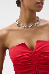 Profile view of model wearing the Oroton Elin Necklace in Clear/Silver and Brass base for Women .